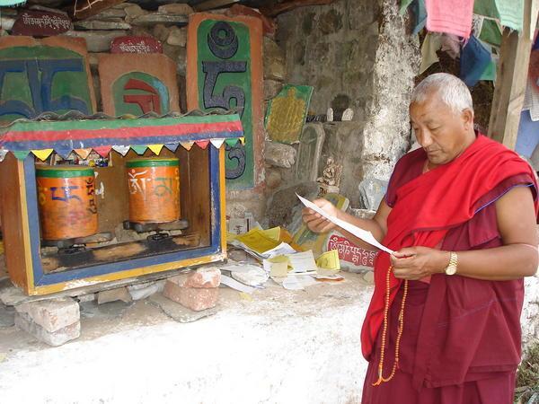 Monk Beside the Prayer Wheels