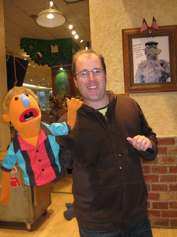 Scott playing with muppets at  FAO Schwartz