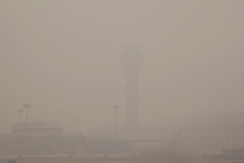 The aircraft control tower from the runway at Beijing International Airport.