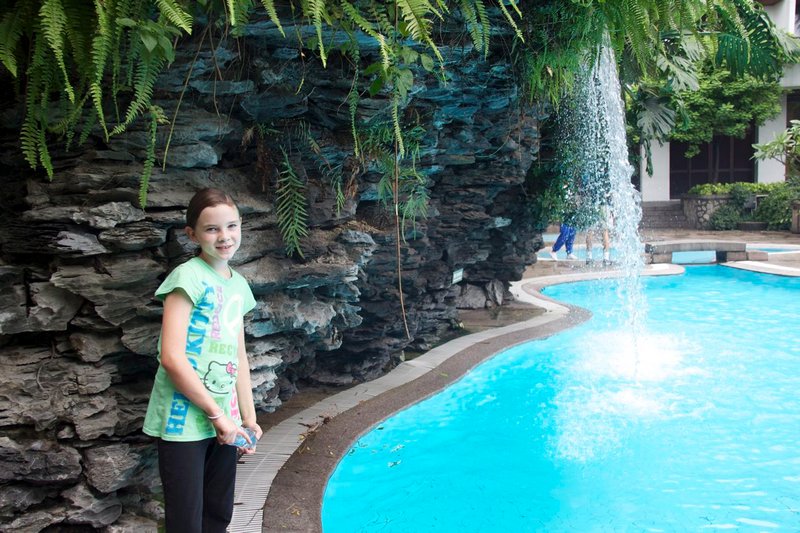 Emma at the swimming pool waterfall