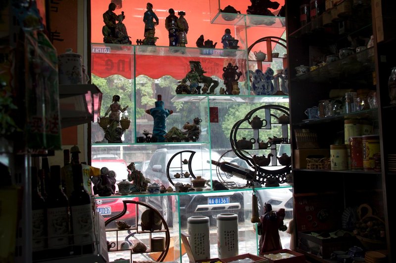 Looking out window of Shamian Island Shop