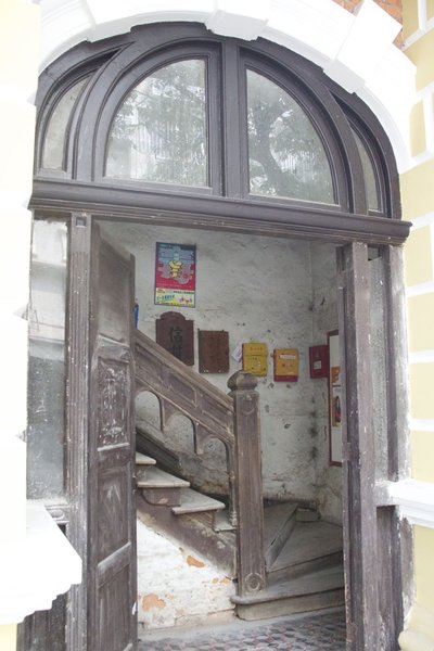Peek inside old staircase of Shamian Island building.