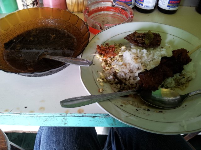 Delicious Gule with rice and  chicken Sate at Bromo