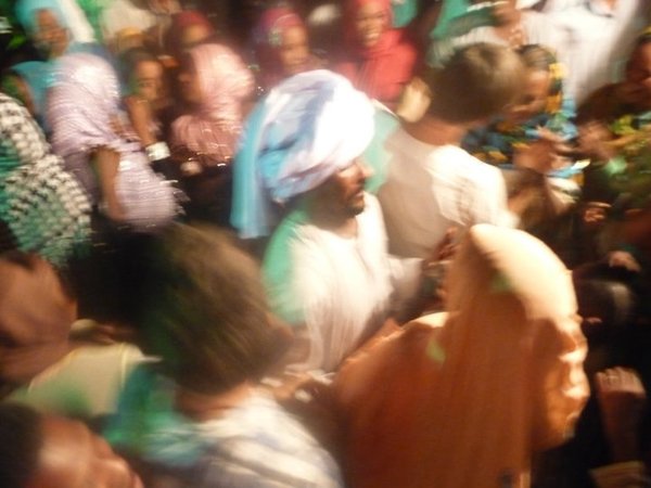 At the wedding. The party clown is the one in the turban.