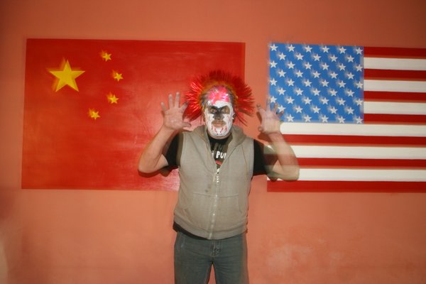 Eddie betwen the Chinese and American flags!