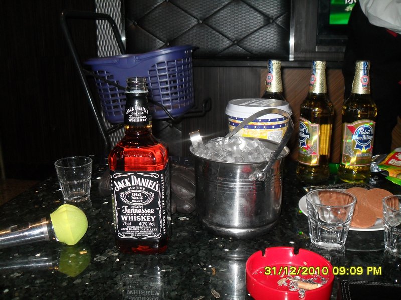 A karaoke microphone and a bottle of jack...