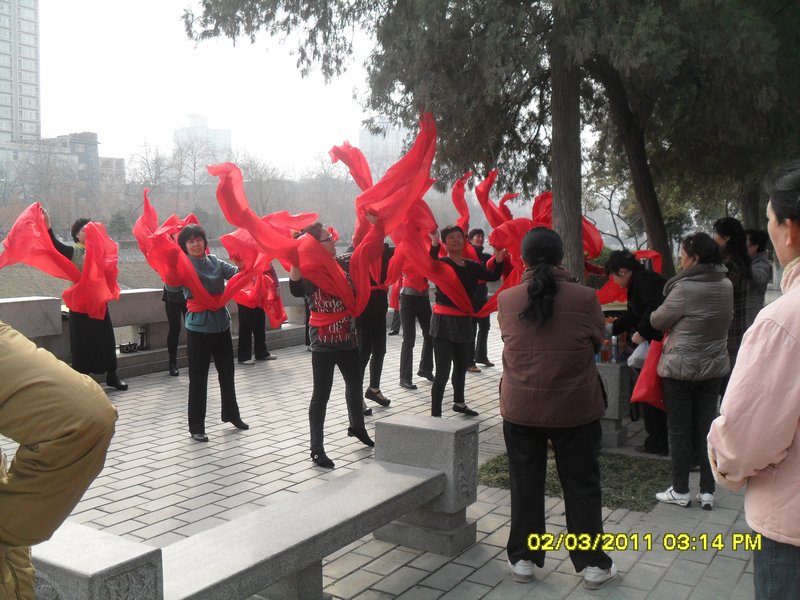 15. A group of dancers practising alongside the walls