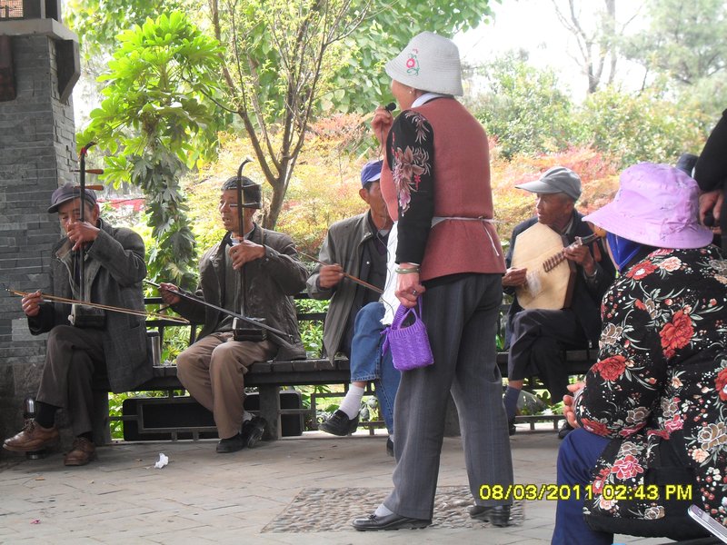 14. A couple of locals playing some music in the old town of Kunming; then this lady gets up and sings for them-fantastic!