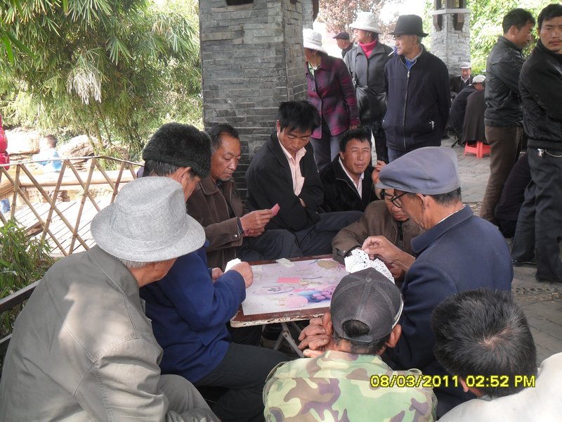 17. The local men playing some cards