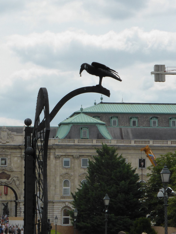 Black raven statue on the gate to the Royal Palace
