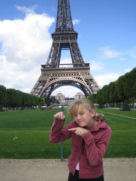 "j" comparing her tiny Eiffel Tower keychain to the real thing