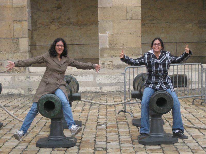 My sister and I on cannon outside Musee de l'Armee