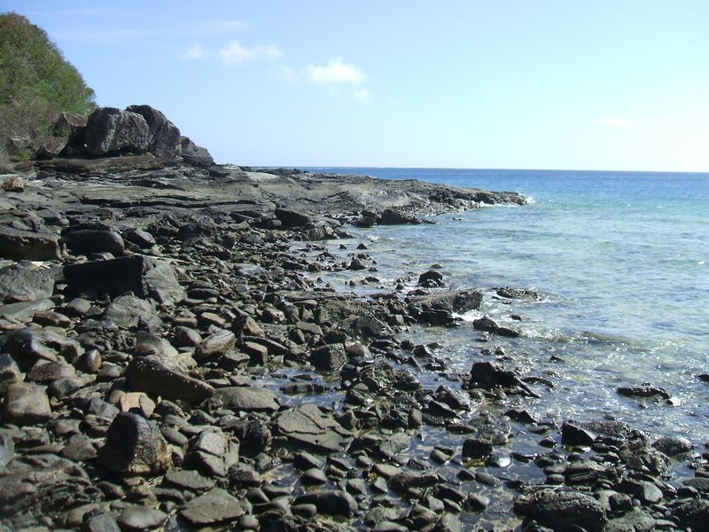 Volcanic rock at one end of beach