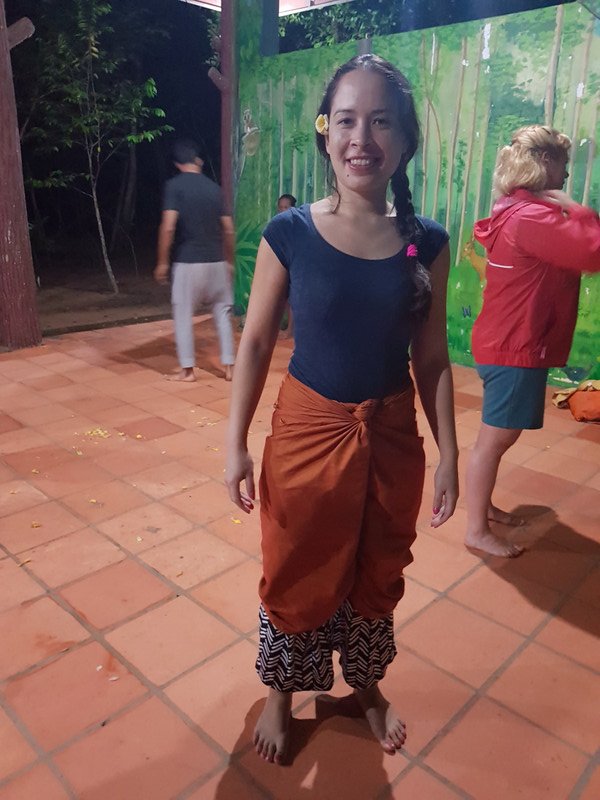 Trying on traditional sarong as pants