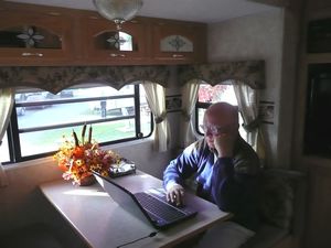 California  - Placerville KOA -    Dwain on computer in the RV
