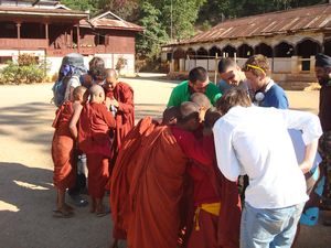 Monks looking at video of leap frog