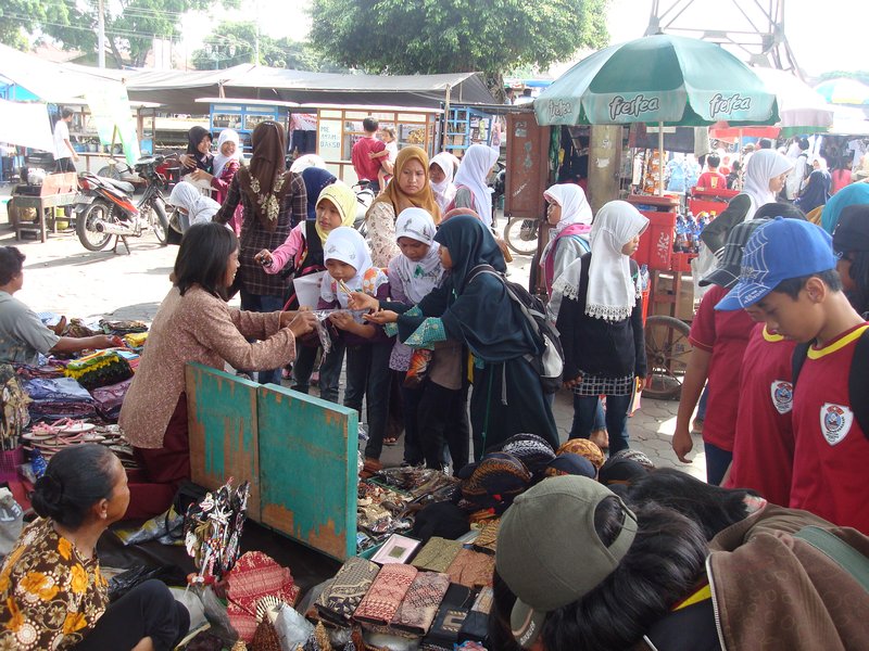 Young girls buying souvenirs
