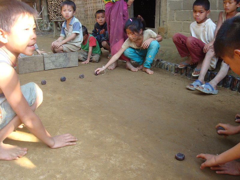 Kids playing games in village near Muang Ngoi Neua