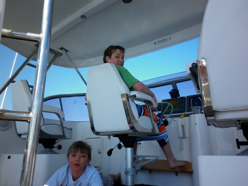 Warren's boat at the helm