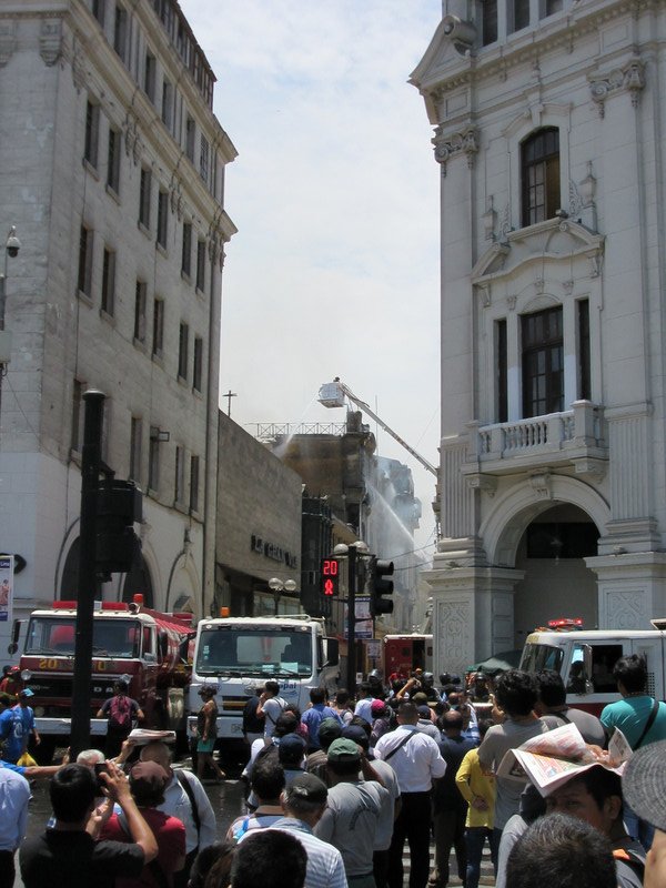 Peruvian firefighters tackling a blaze