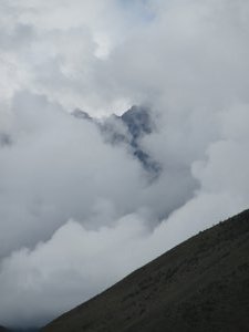 Ollantaytambo - Clouds covering the snow capped mountains