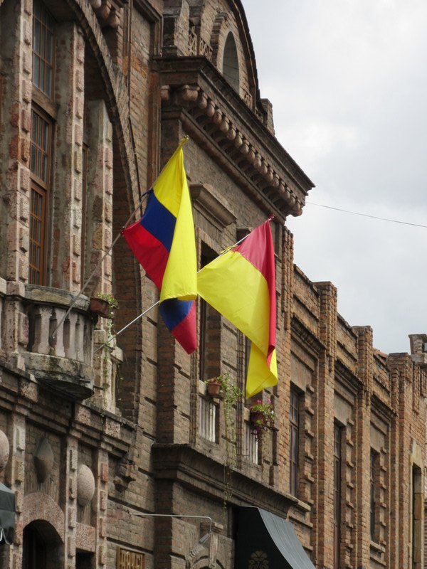 Buildings around town - Ecuador and regional flags