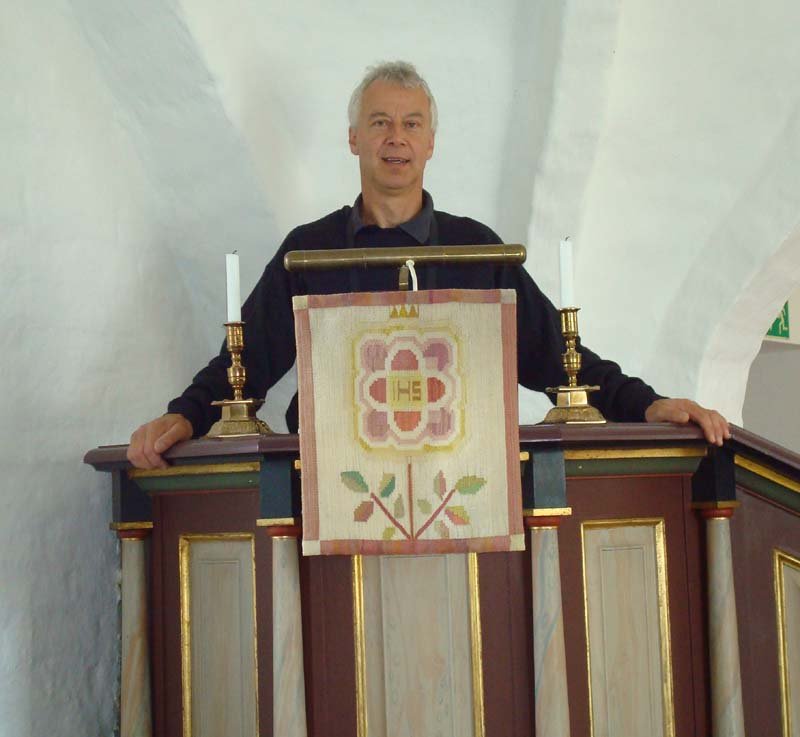 Jan preaching in the Pulpit