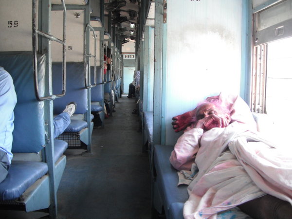 old man sleeping off the Bangalassi (notice wild purple hair) on train to Varanasi