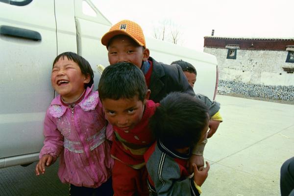 cute kids outside of lhasa