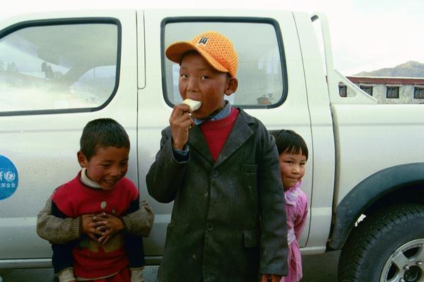 cute kids outside of lhasa