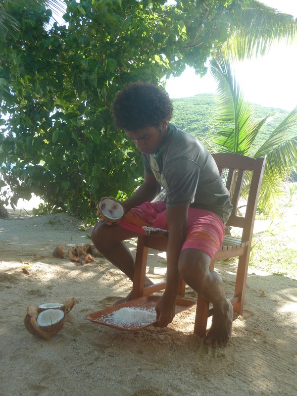 Ruben grating a coconut