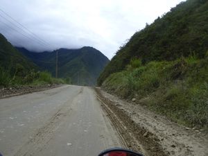 Driving over a mudslide caused by the heavy rains 