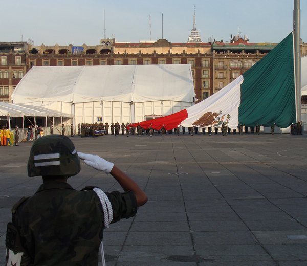 Raising the Mexican flag