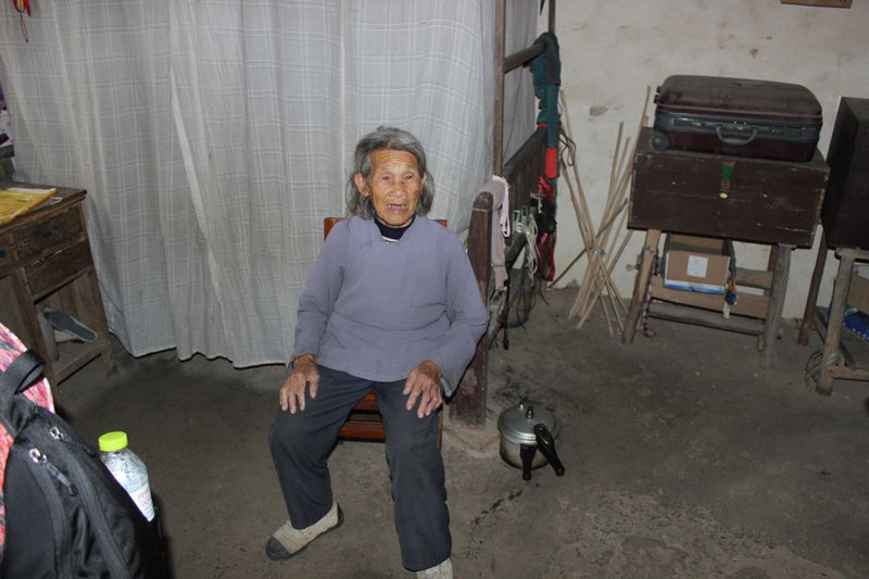 Old woman in her home, Youngshuo, China