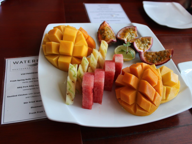 Fruit plate: Pineapple, watermelon, passion fruit, and two types of papaya