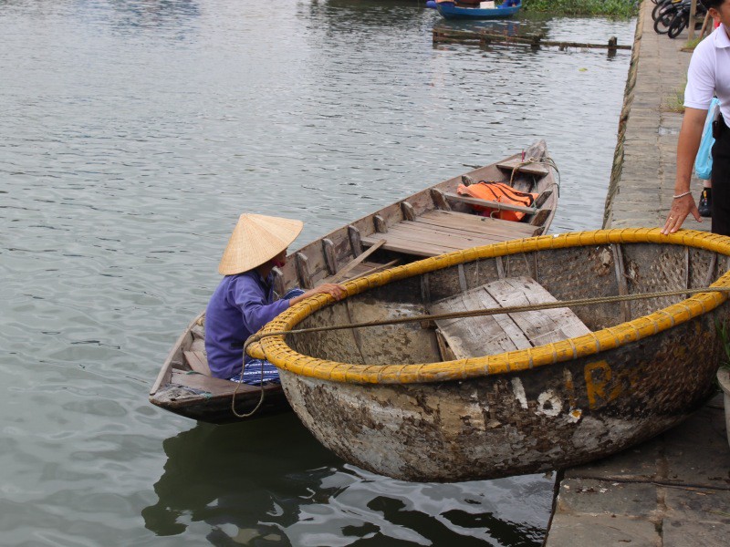 Two examples of personal watercraft on the canal in Hoi An