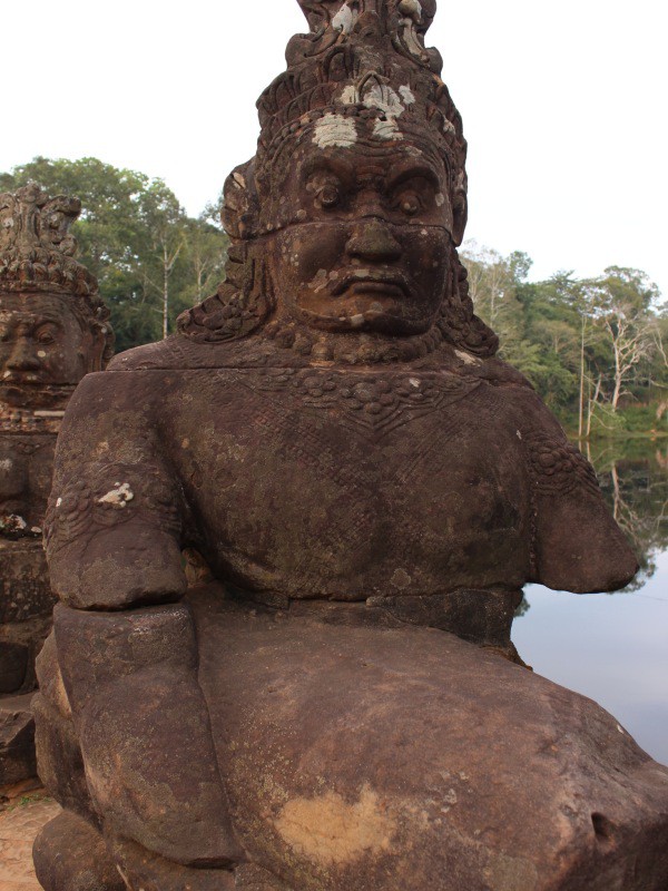 Warrior guarding the bridge to Angkor Thom