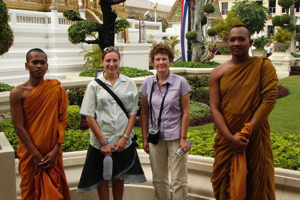 Mom and Carol with a Couple Monks