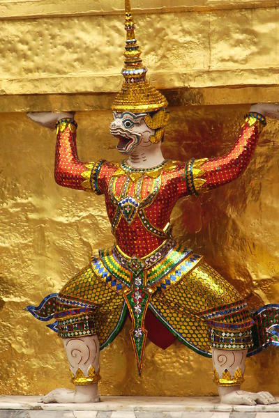 Demon Man holding up the Stupa