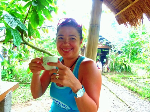 Shelly "enjoying" a cup of Luwak Coffee
