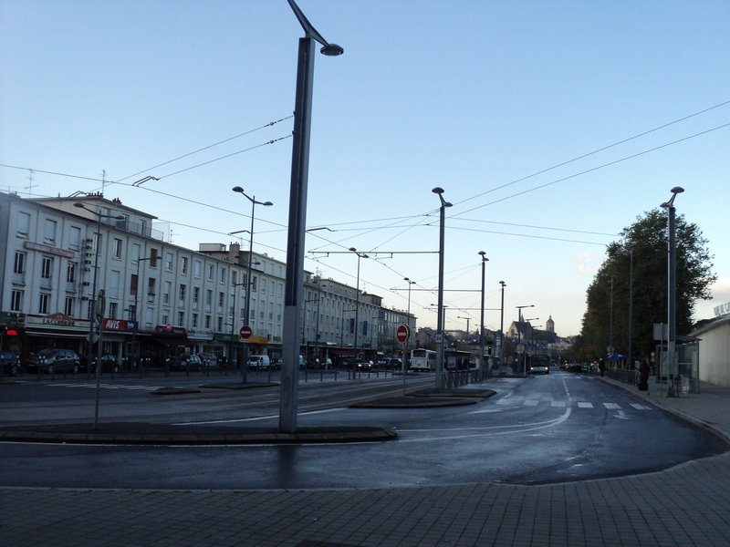 The tram stop/ street by bus/train stations