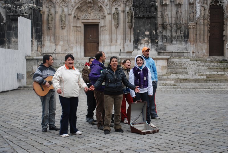 People Singing in Front of the Dom
