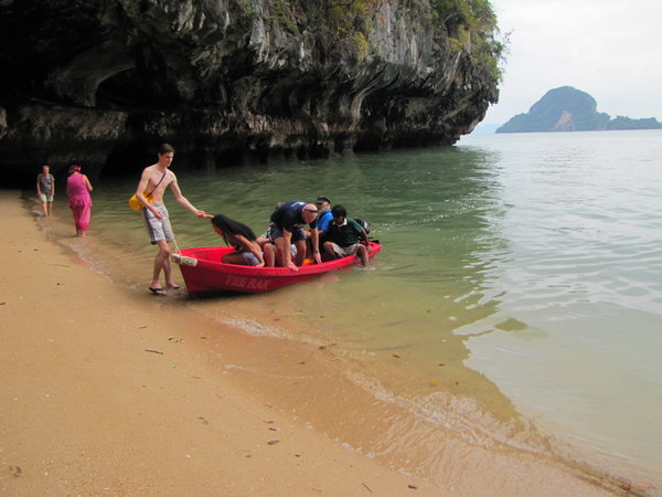 unloading from skiff to explore caves
