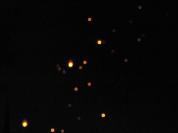 Lanterns float in the sky