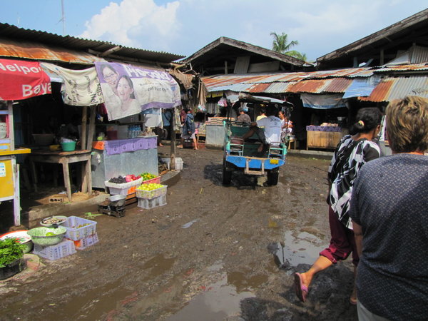 walking through the muddy market after a flash torrential rain