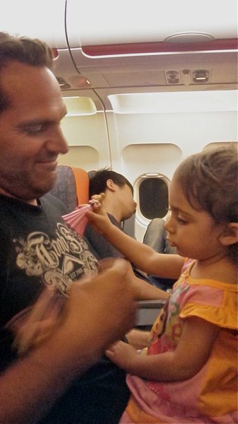Playing princesses with new Spanish friend on the plane to Switzerland