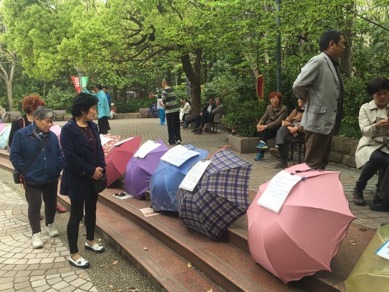 Umbrellas advertising people's children for potential suitors and other matchmakers