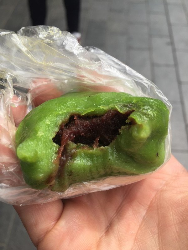 Green-dyed rice cake filled with red bean