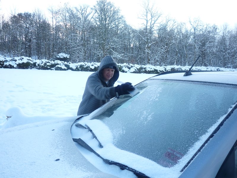 Gordon scrapping the ice off the windscreen