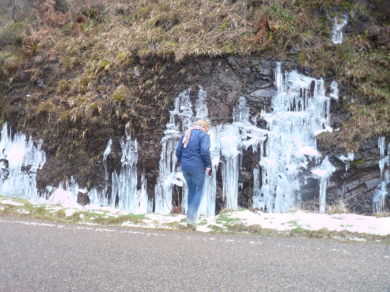 Touching a frozen waterfall